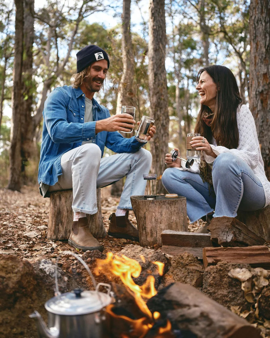 Cups by the fire and in the forest near home