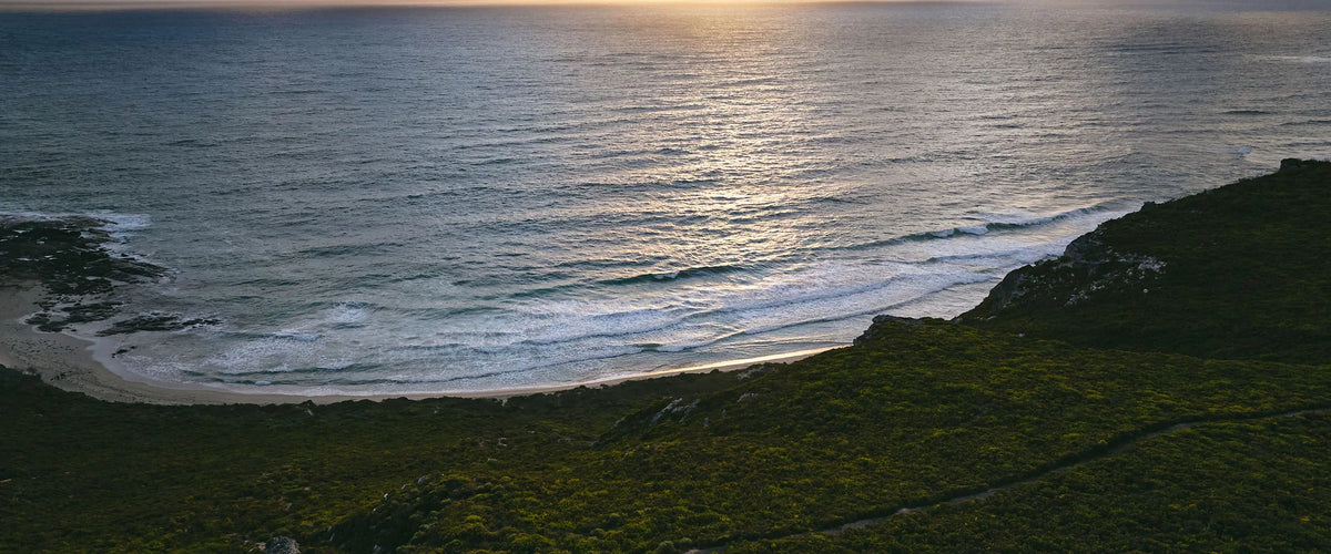 Sunset over the bay and headland at Margaret River, Western Australia