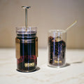 GROUNDD xpress brewing coffee beside a second cup of loose leaf tea