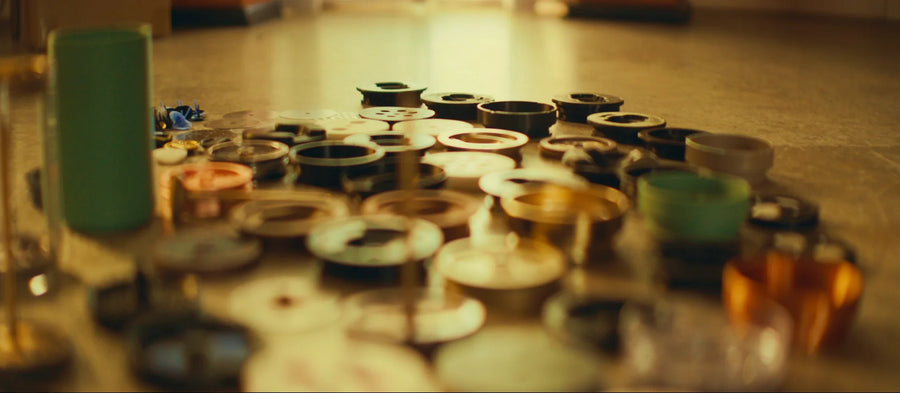 The piston, the filter and the prototype parts on the workshop bench