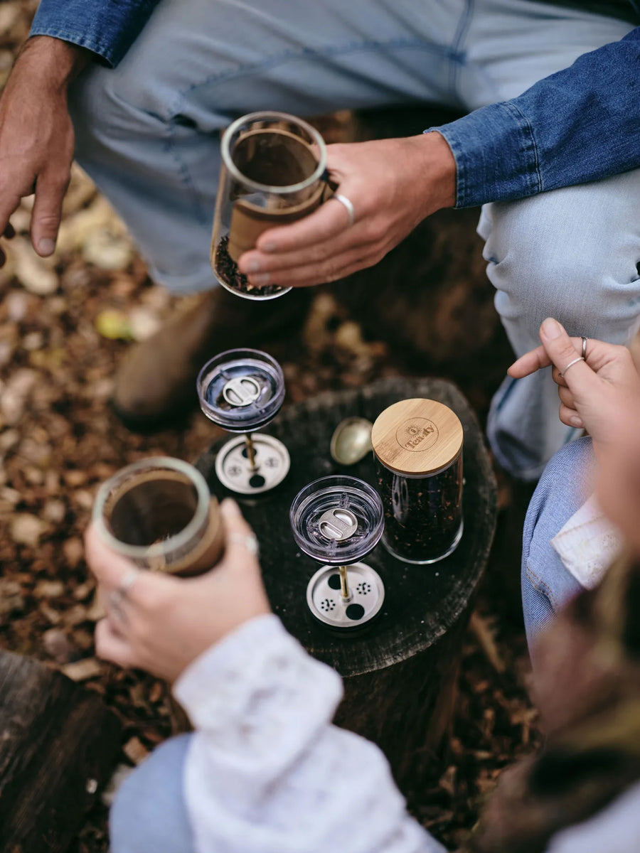 Cups and components laid out on the ground on a trip