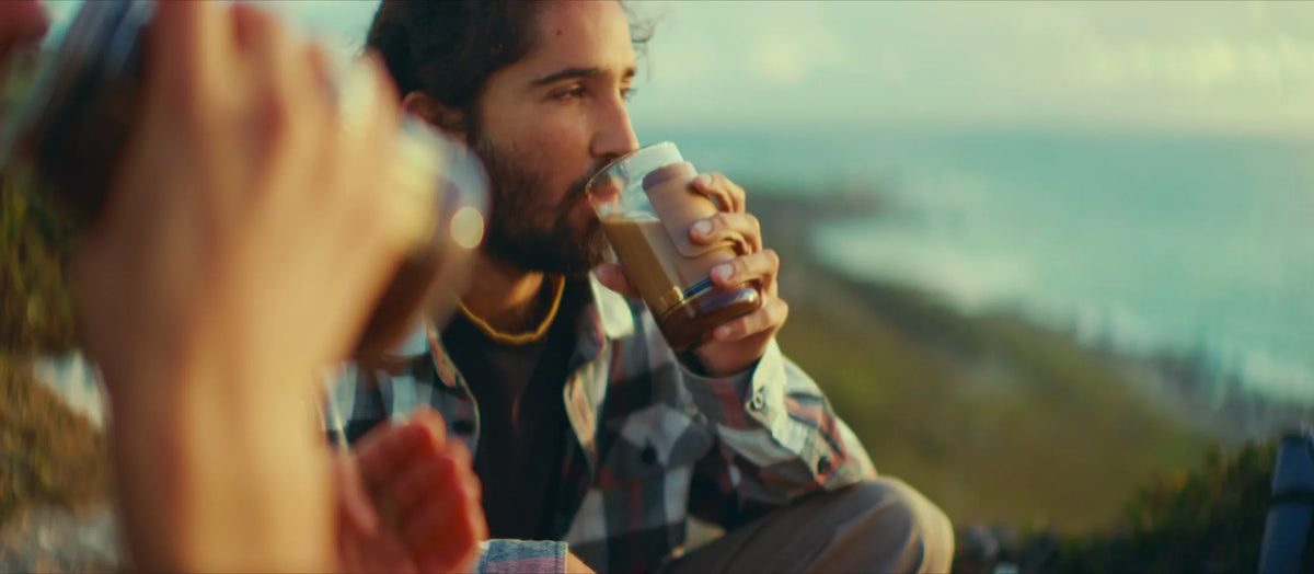 Drinking coffee from the GROUNDD xpress on the coast